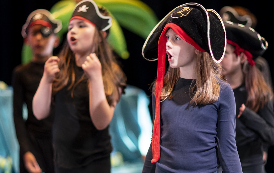 A group of under 12s dressed as pirates performing in a play