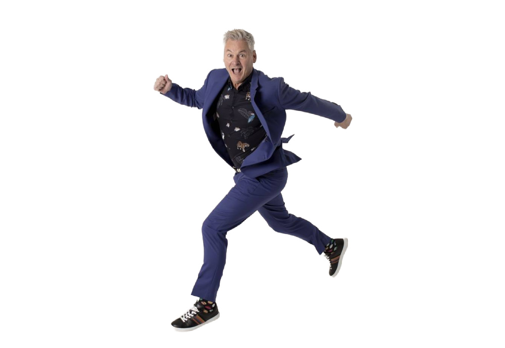 Phil Walker taking a running jump against a white background